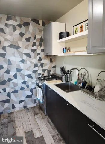 a kitchen with a sink and cabinets