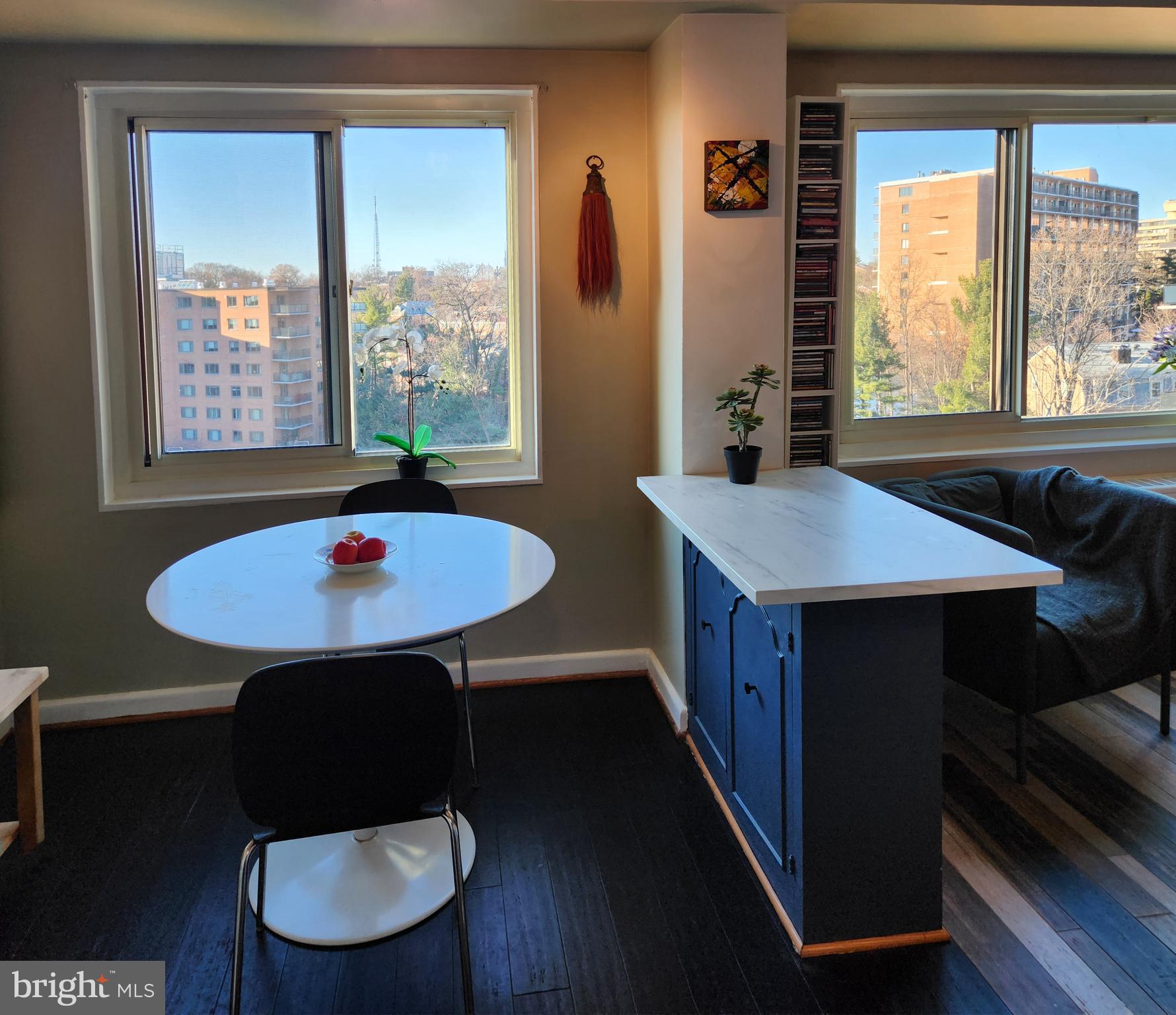 4201 Cathedral Avenue Northwest, Unit 1418E Washington, DC 20016 - Photo 10 of 17 a dining room with a table chairs and a table