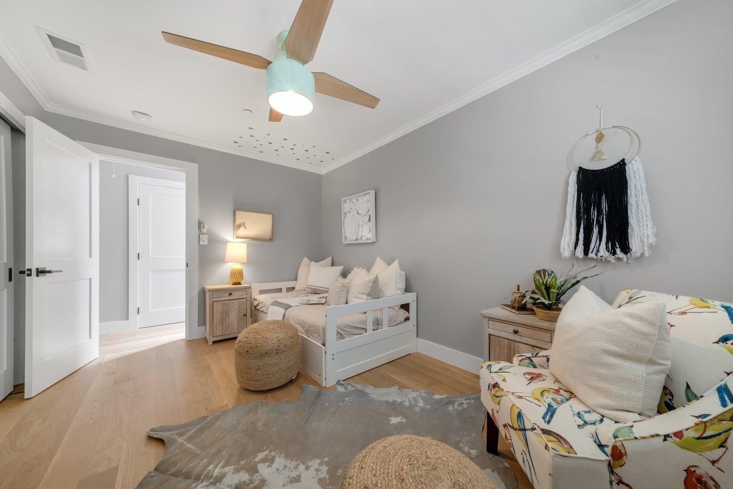 7 Del Monte Place San Mateo, CA 94403 - Photo 11 of 16 a bedroom with furniture and a chandelier