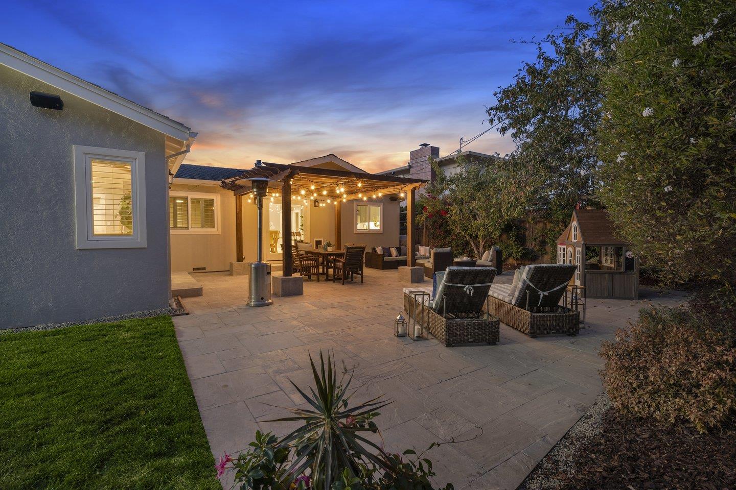 7 Del Monte Place San Mateo, CA 94403 - Photo 14 of 16 a view of a patio with couches and table and chairs and potted plants