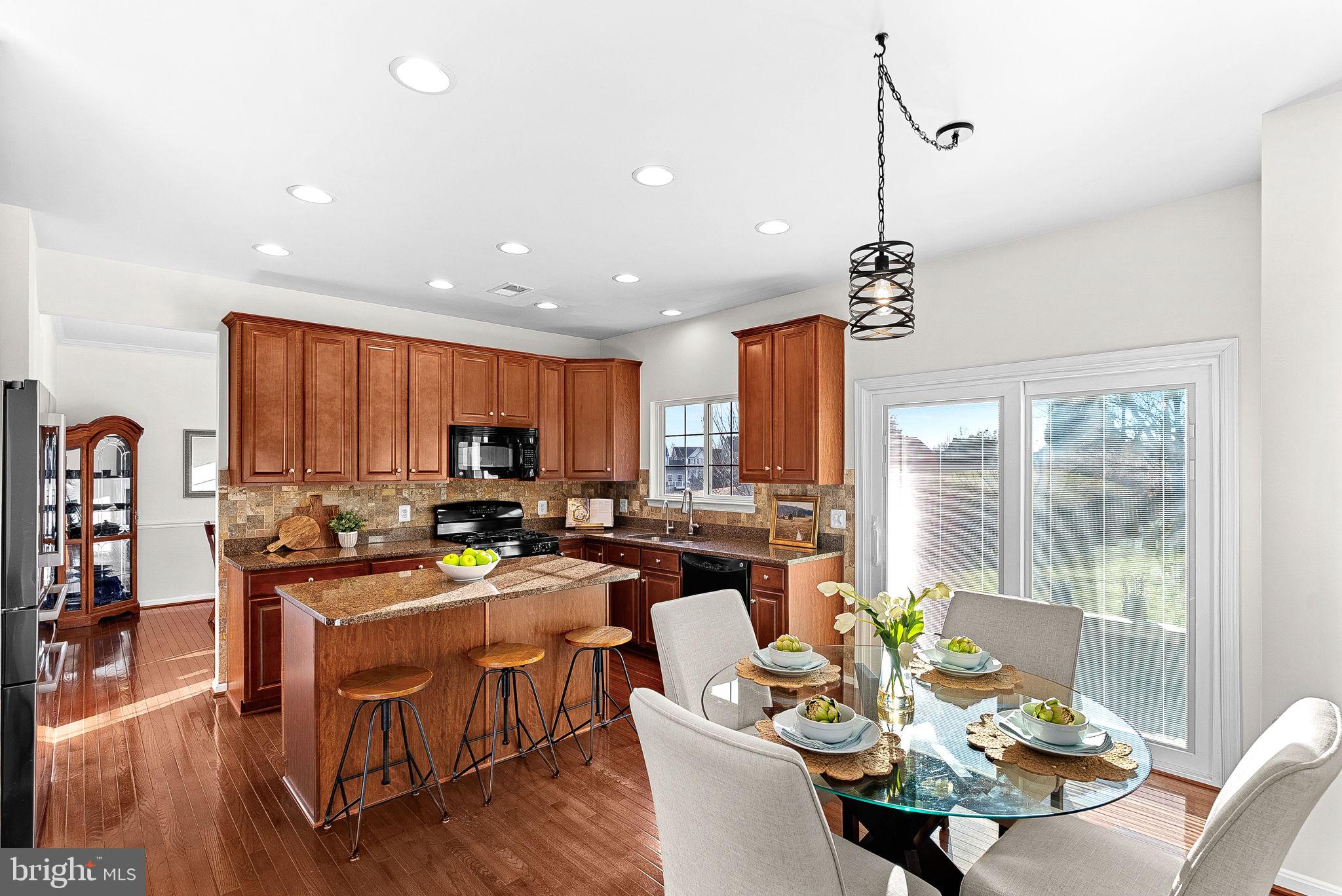 809 Devonshire Circle Purcellville, VA 20132 - Photo 11 of 36 a view of a dining room and livingroom with furniture window and wooden floor