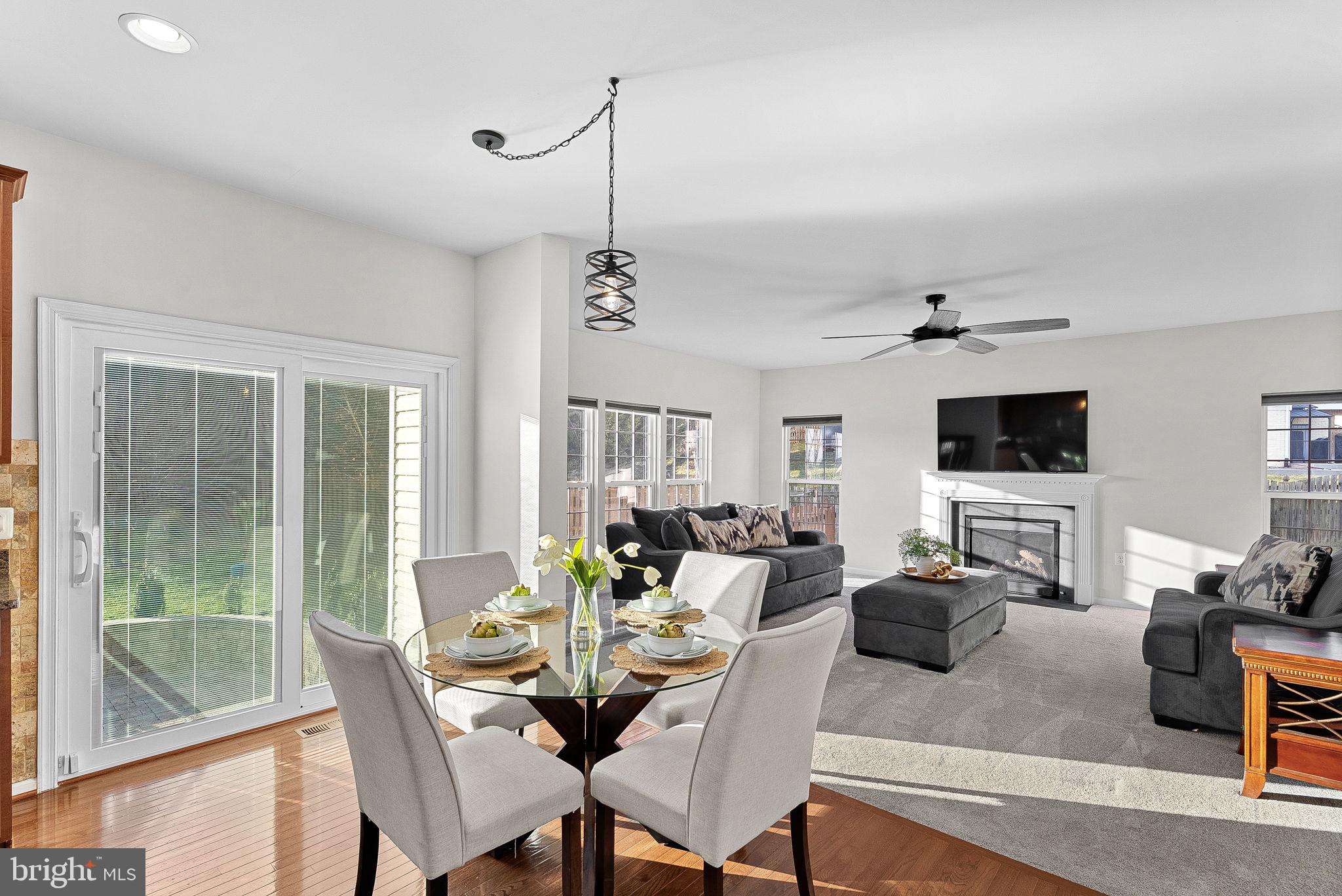 809 Devonshire Circle Purcellville, VA 20132 - Photo 13 of 36 a living room with furniture a flat screen tv and a window