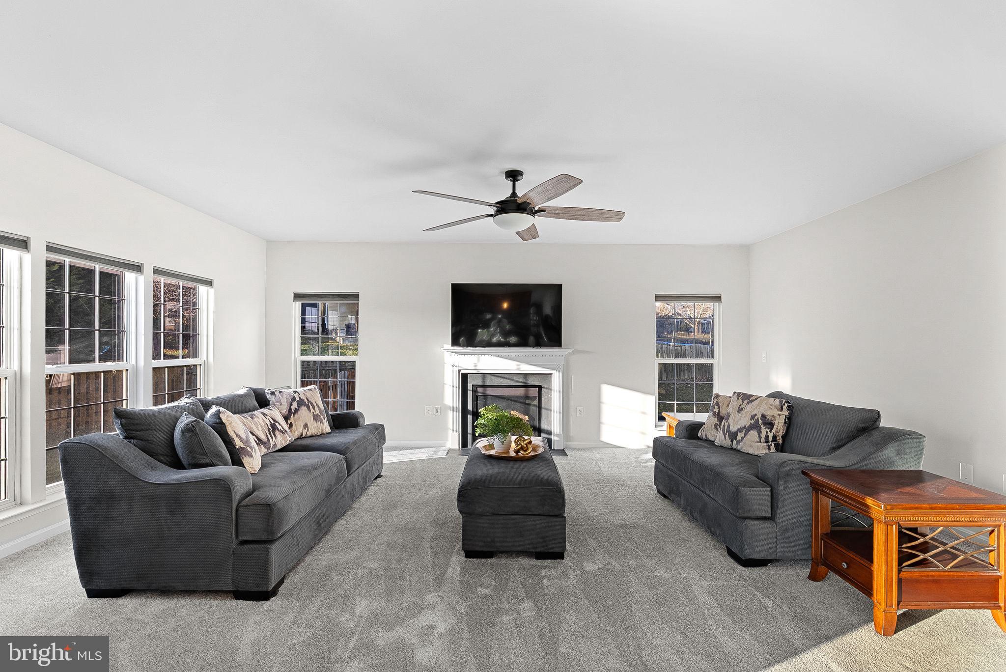 809 Devonshire Circle Purcellville, VA 20132 - Photo 15 of 36 a living room with furniture and a flat screen tv