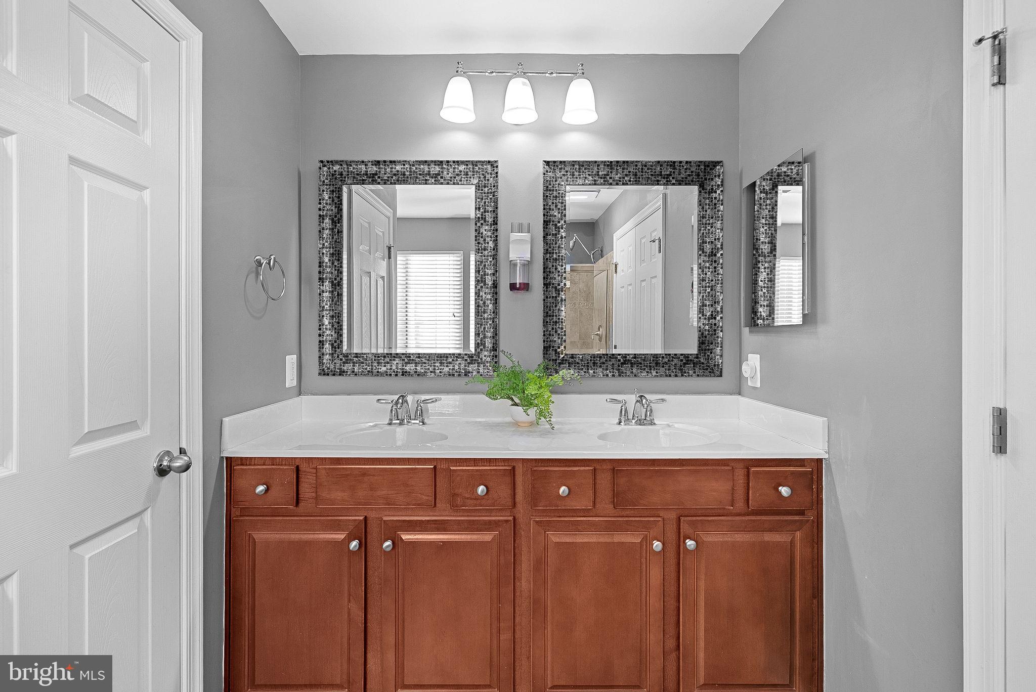 809 Devonshire Circle Purcellville, VA 20132 - Photo 23 of 36 a bathroom with a double vanity sink and a mirror