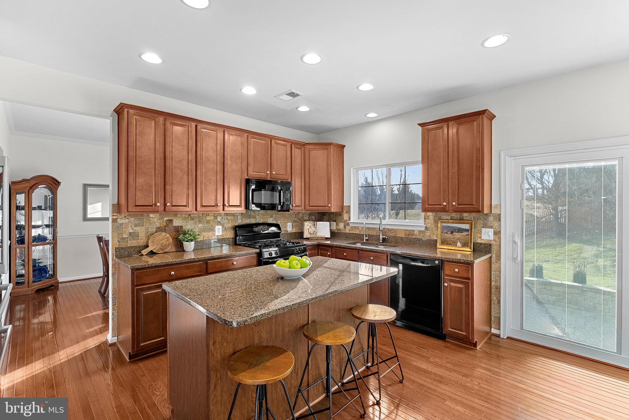 809 Devonshire Circle Purcellville, VA 20132 - Photo 8 of 36 a kitchen with a sink a stove a refrigerator cabinets and wooden floor