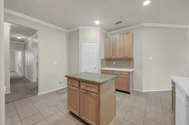 a kitchen with a stove top oven sink and cabinets