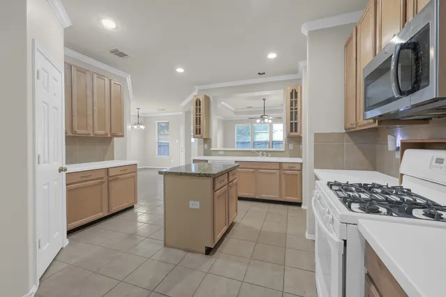 a kitchen with a cabinets and window