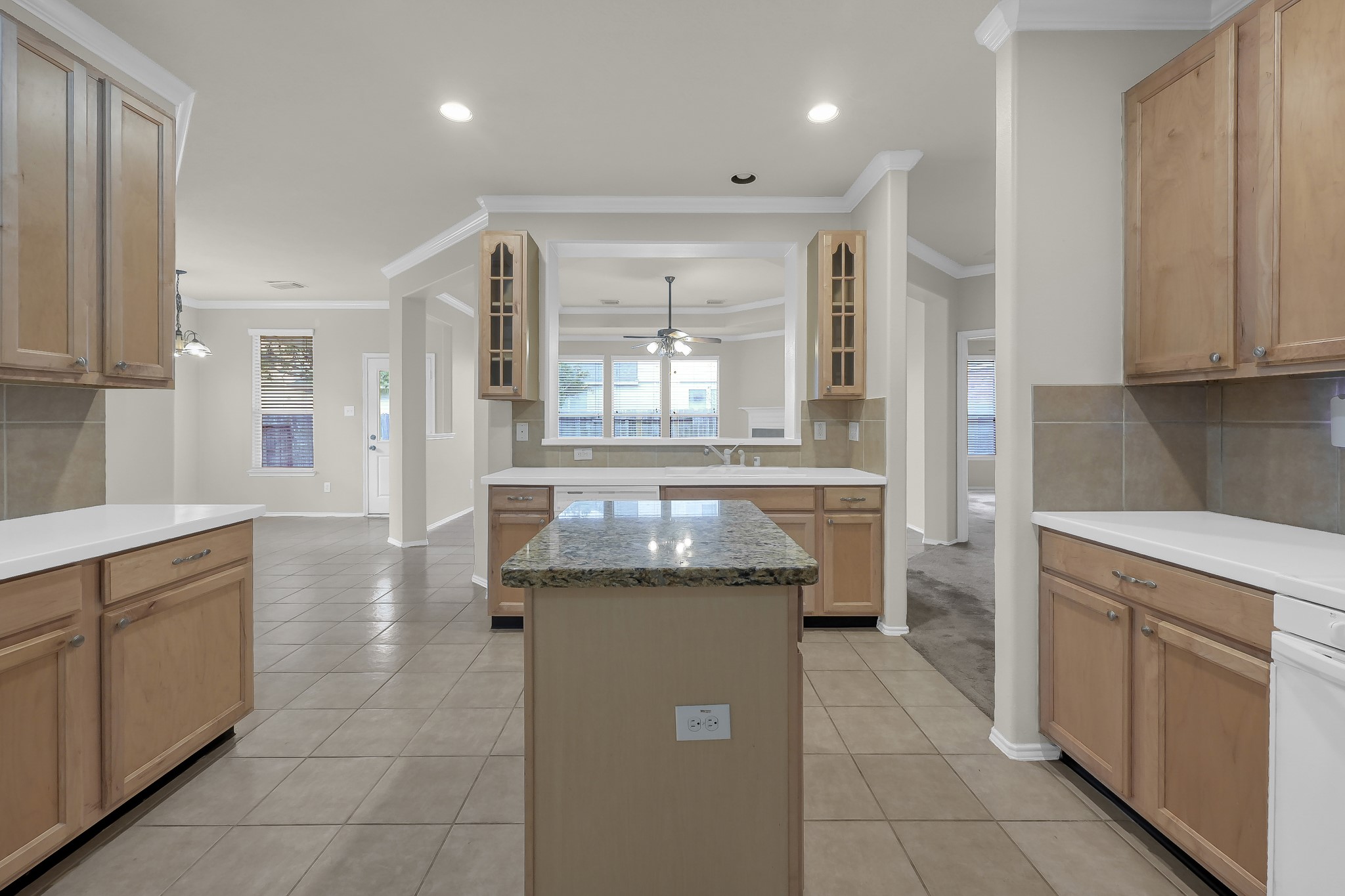 951 Crannog Way Conroe, TX 77301 - Photo 17 of 43 a kitchen with a cabinets and window