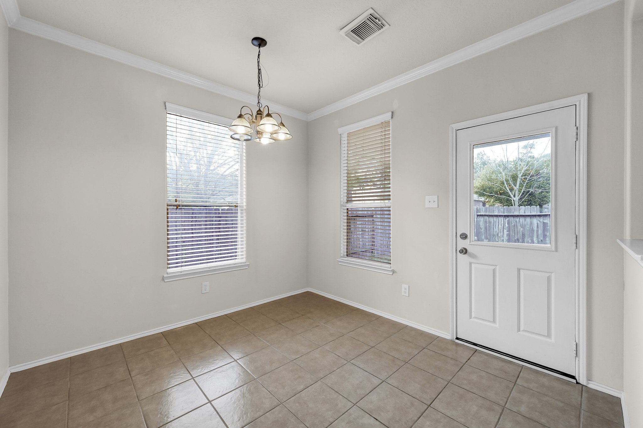951 Crannog Way Conroe, TX 77301 - Photo 18 of 43 a view of an empty room with a window