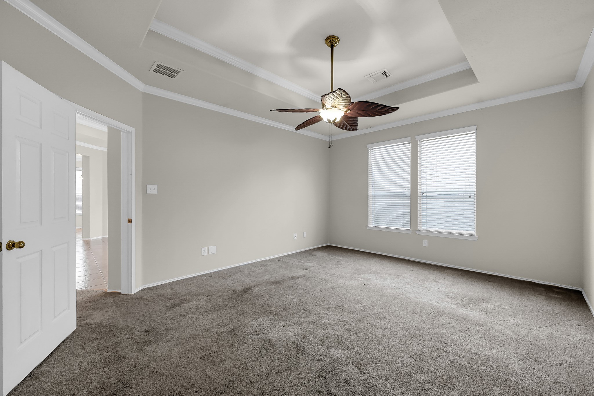 951 Crannog Way Conroe, TX 77301 - Photo 22 of 43 an empty room with a ceiling fan and window