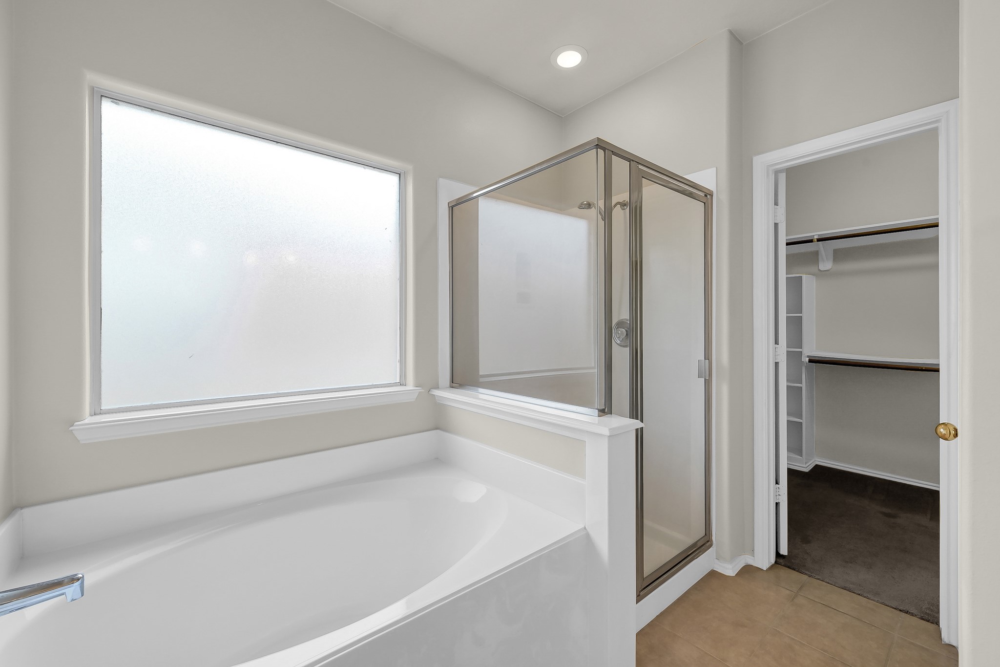 951 Crannog Way Conroe, TX 77301 - Photo 24 of 43 a bathroom with a shower and a glass door