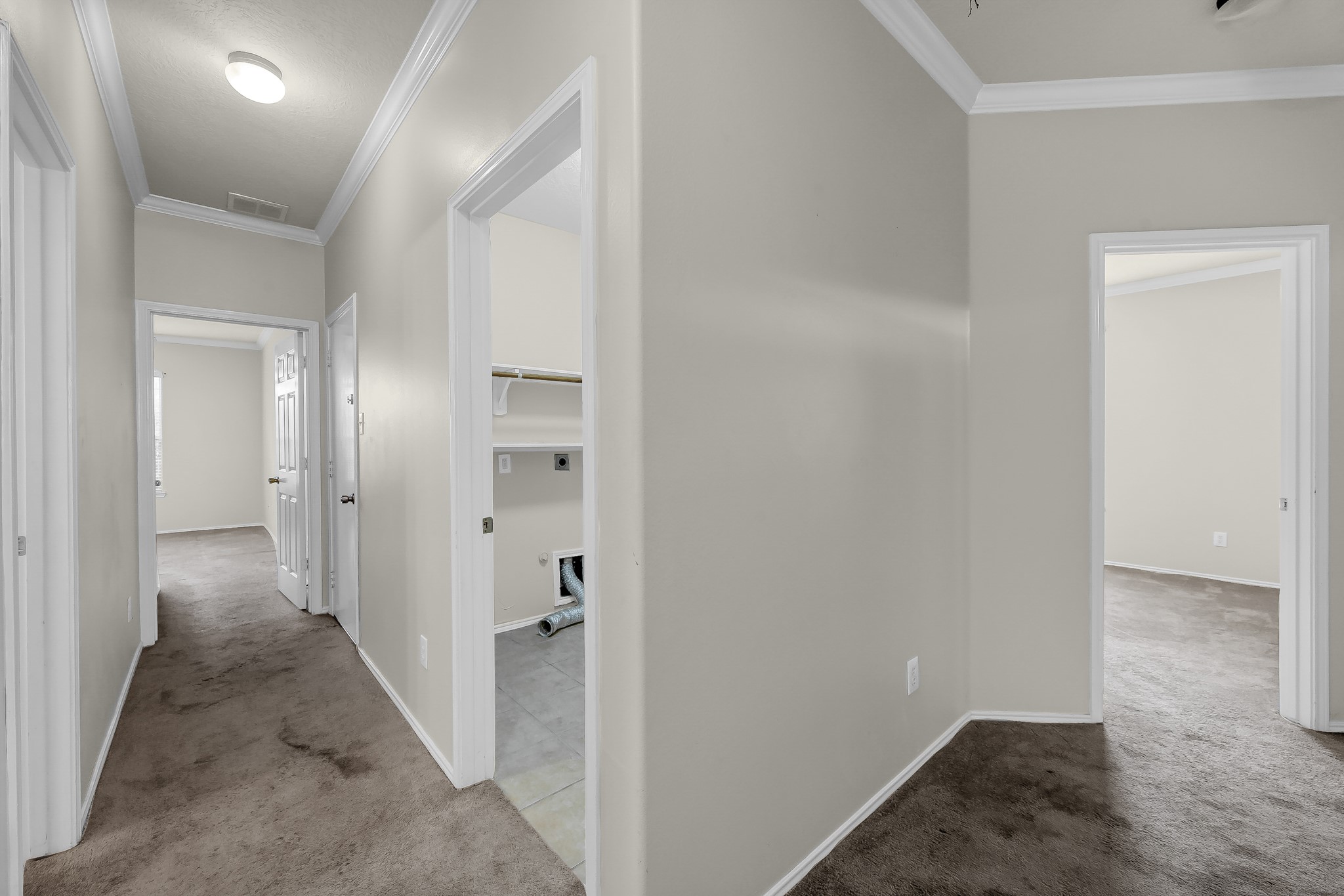 951 Crannog Way Conroe, TX 77301 - Photo 26 of 43 a view of a hallway with a wooden shelves