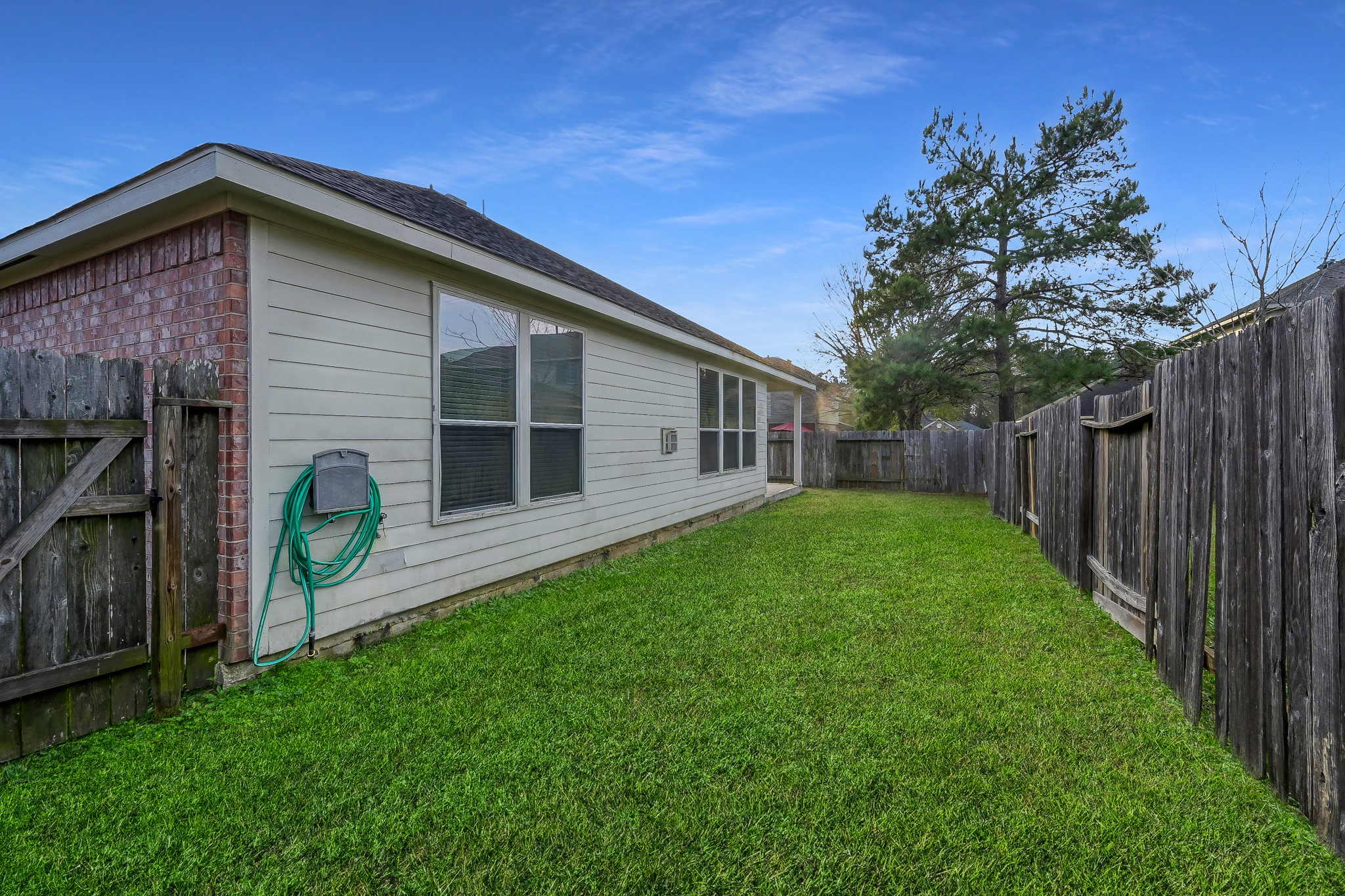 951 Crannog Way Conroe, TX 77301 - Photo 37 of 43 a view of a house with backyard and garden