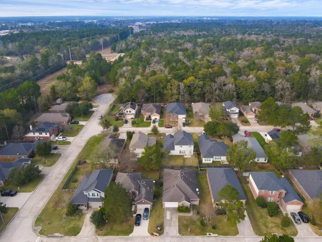 an aerial view of residential houses with outdoor space