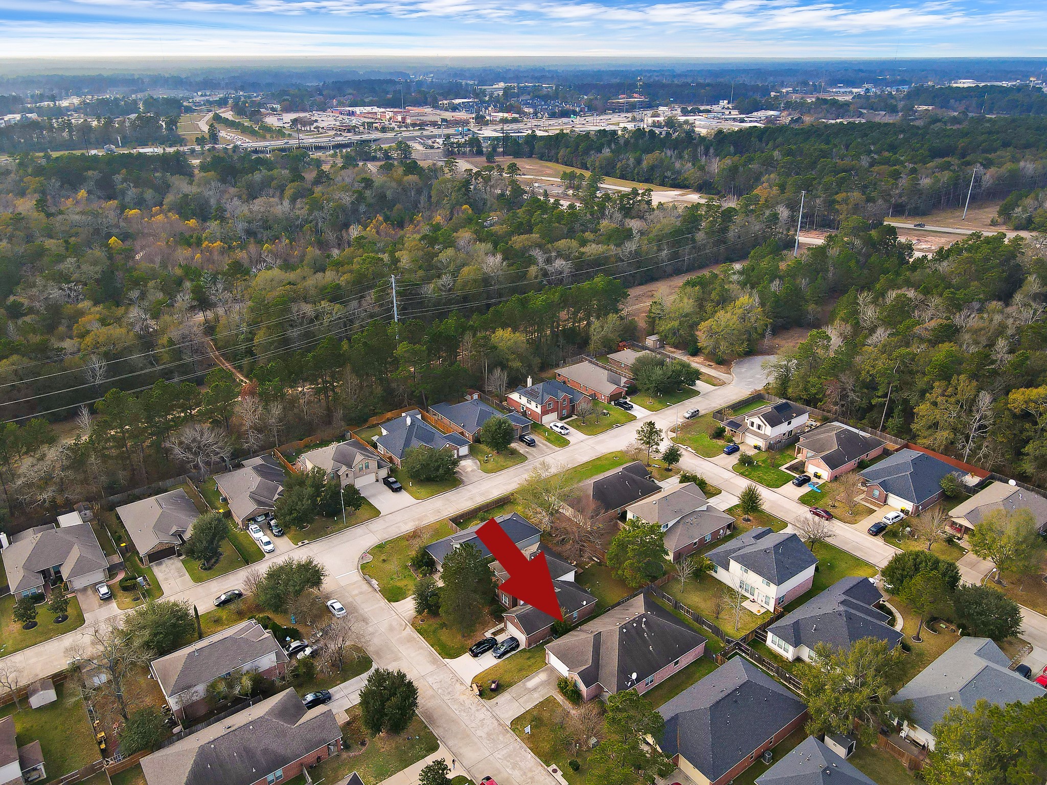 951 Crannog Way Conroe, TX 77301 - Photo 41 of 43 an aerial view of residential houses with outdoor space