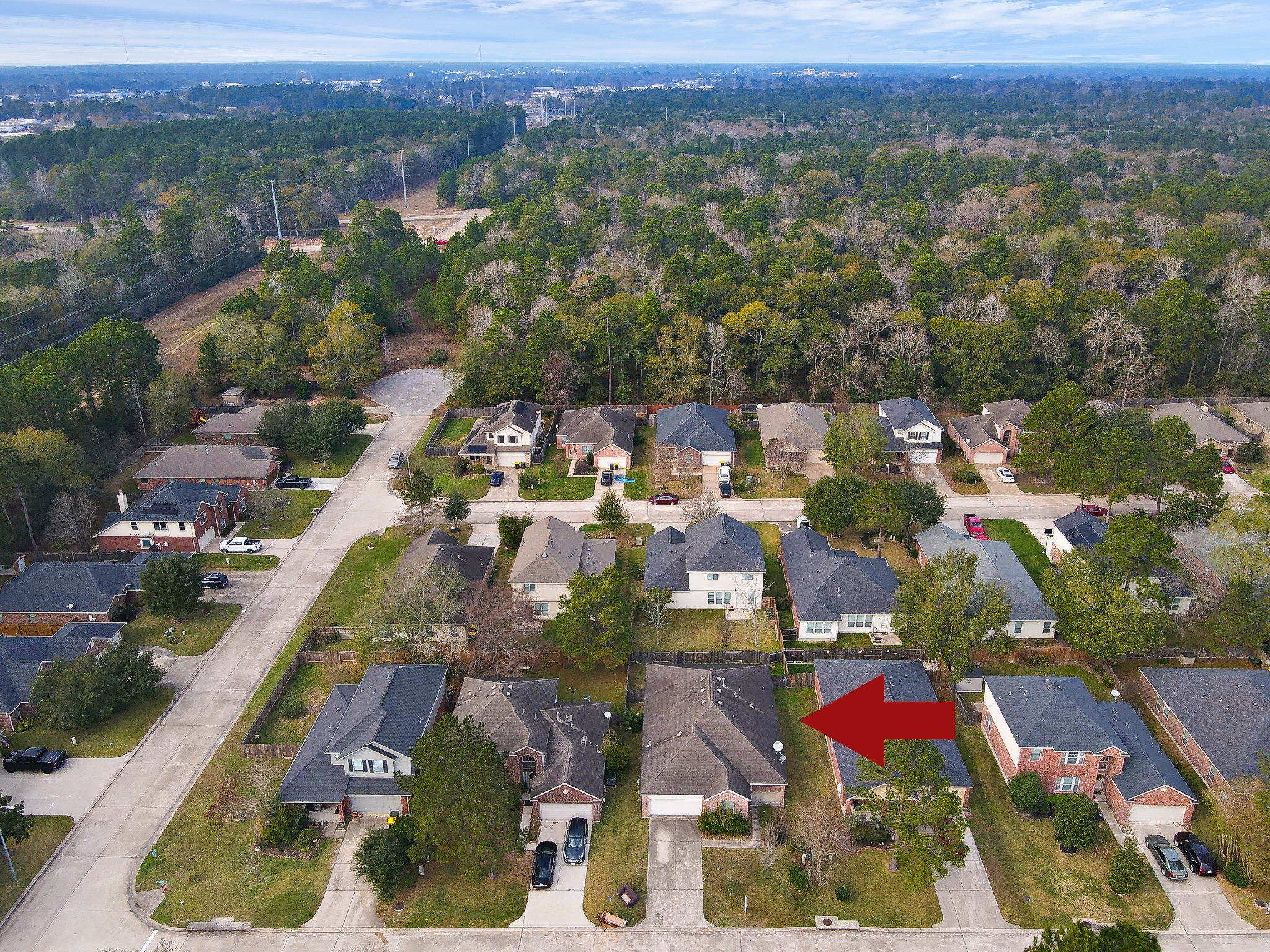 951 Crannog Way Conroe, TX 77301 - Photo 42 of 43 an aerial view of residential houses with outdoor space