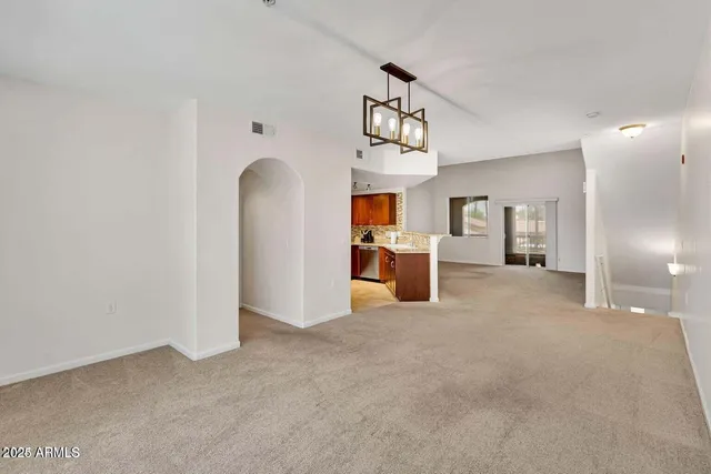 a view of a livingroom with a kitchen