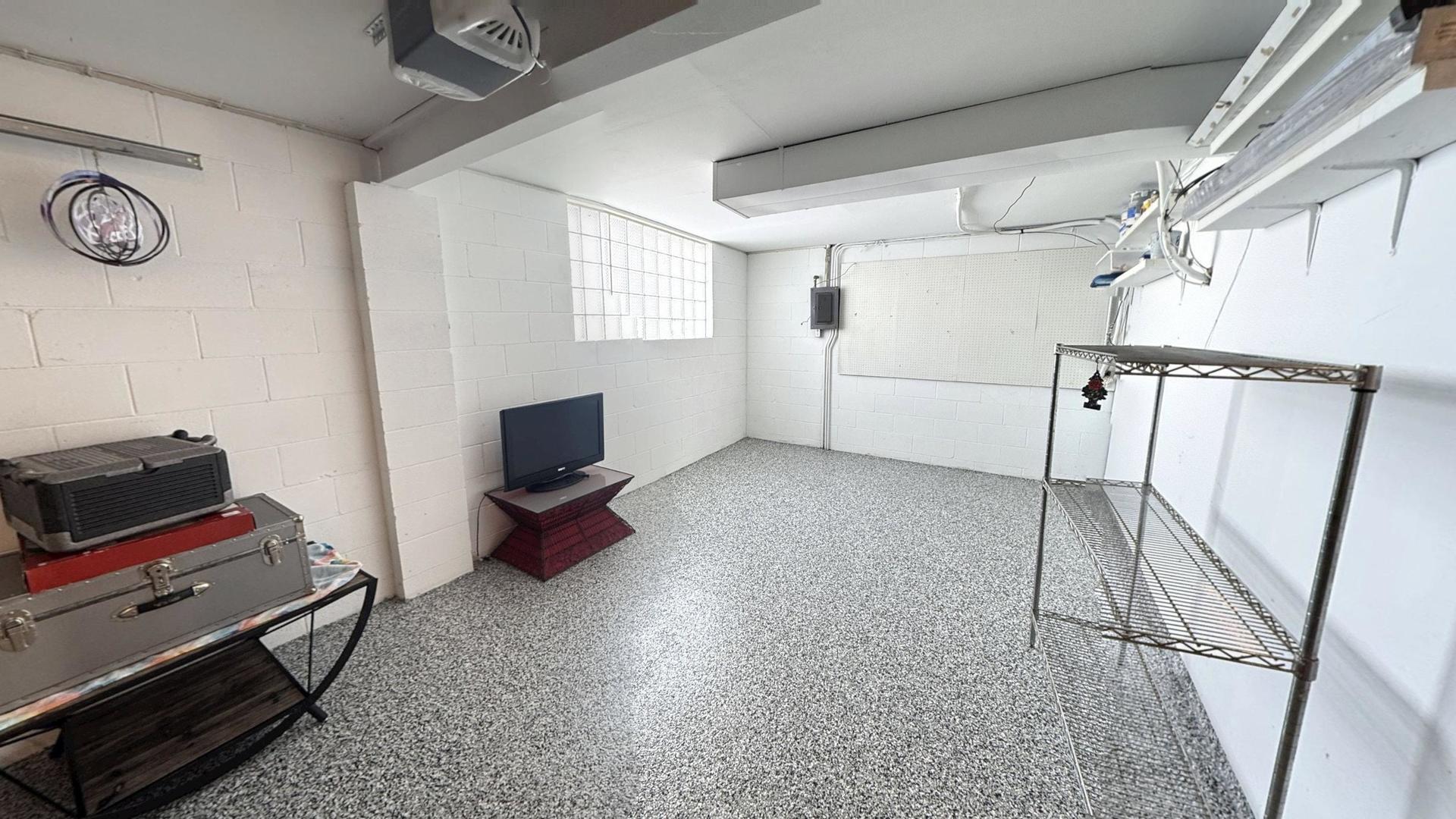 543 Ridge Circle Streamwood, IL 60107 - Photo 20 of 21 a living room with furniture and a flat screen tv