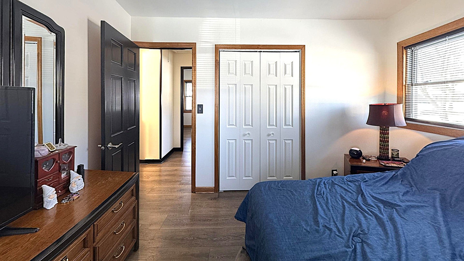 543 Ridge Circle Streamwood, IL 60107 - Photo 10 of 21 a bedroom with a bed and a dresser next to a window