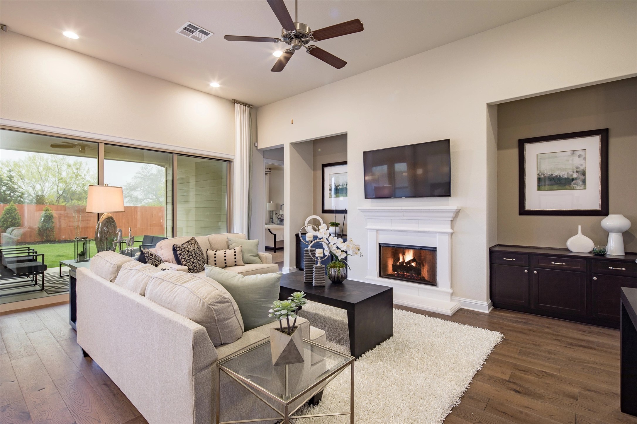 1229 Terrace View Drive Georgetown, TX 78628 - Photo 10 of 17 Relax in this comfortable living area featuring a fireplace and backyard access through sliding glass doors.
