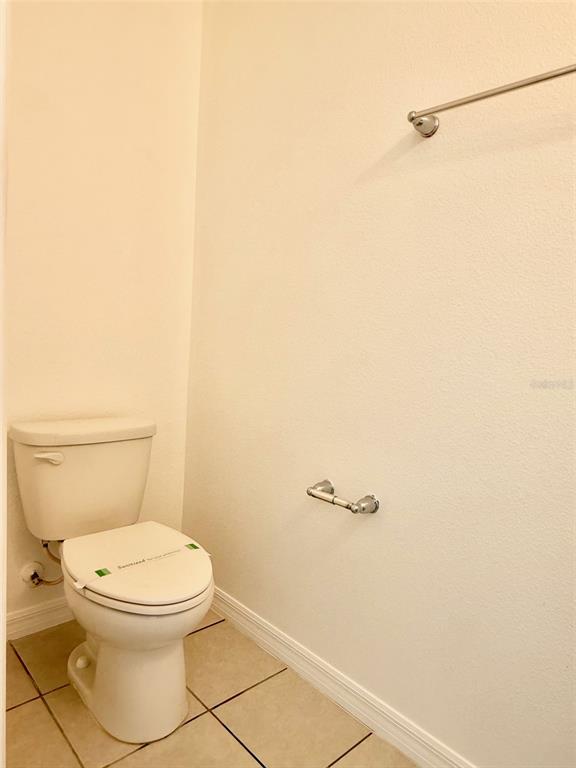 619 Fortanini Circle Ocoee, FL 34761 - Photo 11 of 36 a white toilet sitting next to a shower