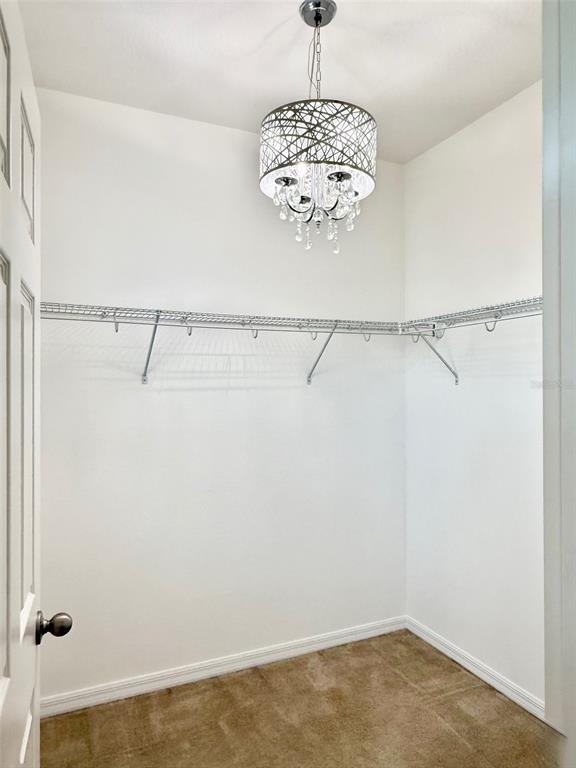 619 Fortanini Circle Ocoee, FL 34761 - Photo 16 of 36 a view of a chandelier in an empty room