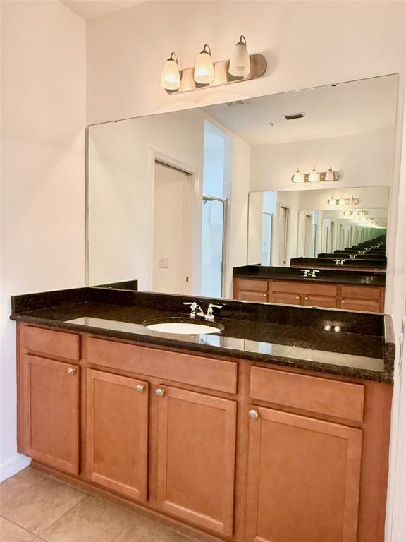 619 Fortanini Circle Ocoee, FL 34761 - Photo 17 of 36 a bathroom with a sink and a mirror