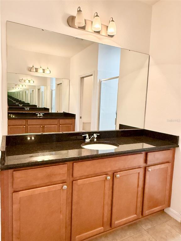 619 Fortanini Circle Ocoee, FL 34761 - Photo 18 of 36 a view of a kitchen with granite countertop cabinets and a sink
