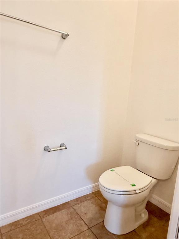 619 Fortanini Circle Ocoee, FL 34761 - Photo 20 of 36 a white toilet sitting next to a shower