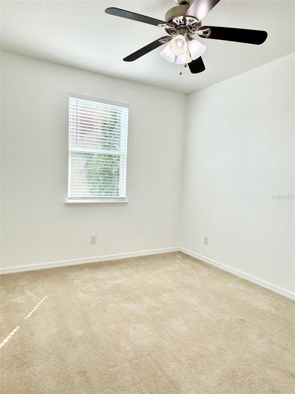 619 Fortanini Circle Ocoee, FL 34761 - Photo 26 of 36 an empty room with windows and fan