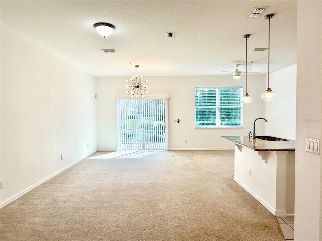 619 Fortanini Circle Ocoee, FL 34761 - Photo 5 of 36 a view of a kitchen with a sink and dishwasher