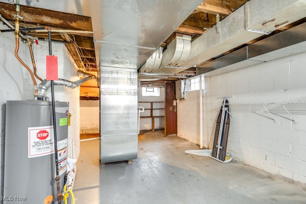 13677 Cedar Road Cleveland, OH 44118 - Photo 46 of 50 Below grade area featuring water heater, heating unit, and electric panel