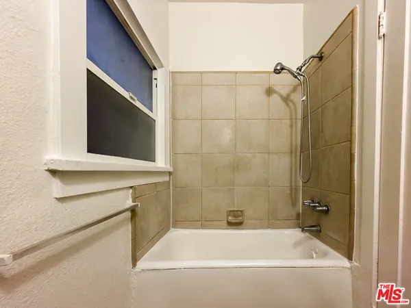 a bathroom with a bathtub and a sink