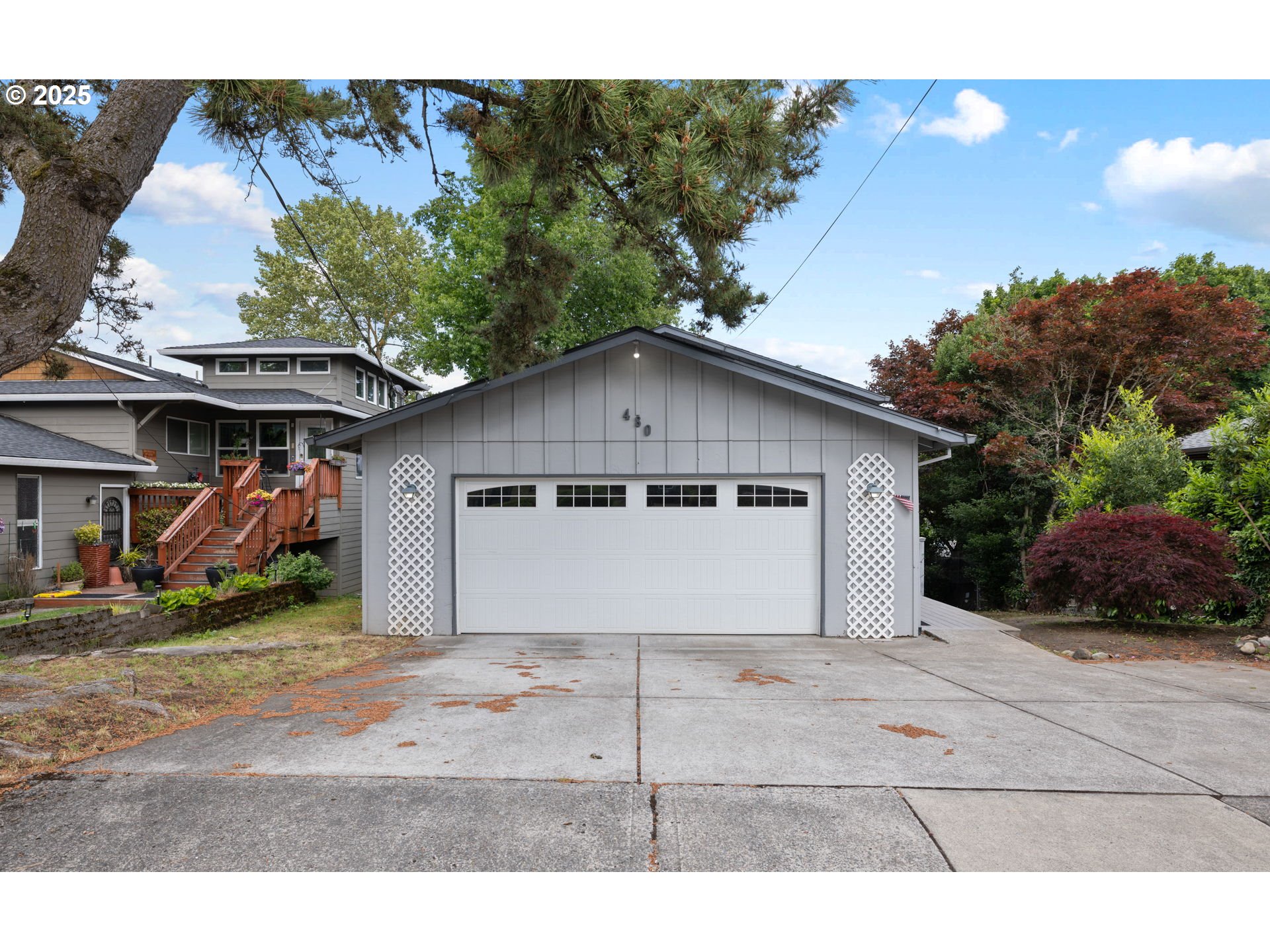 480 Northwest Norman Avenue Gresham, OR 97030 - Photo 1 of 40 a front view of a house with a yard and garage