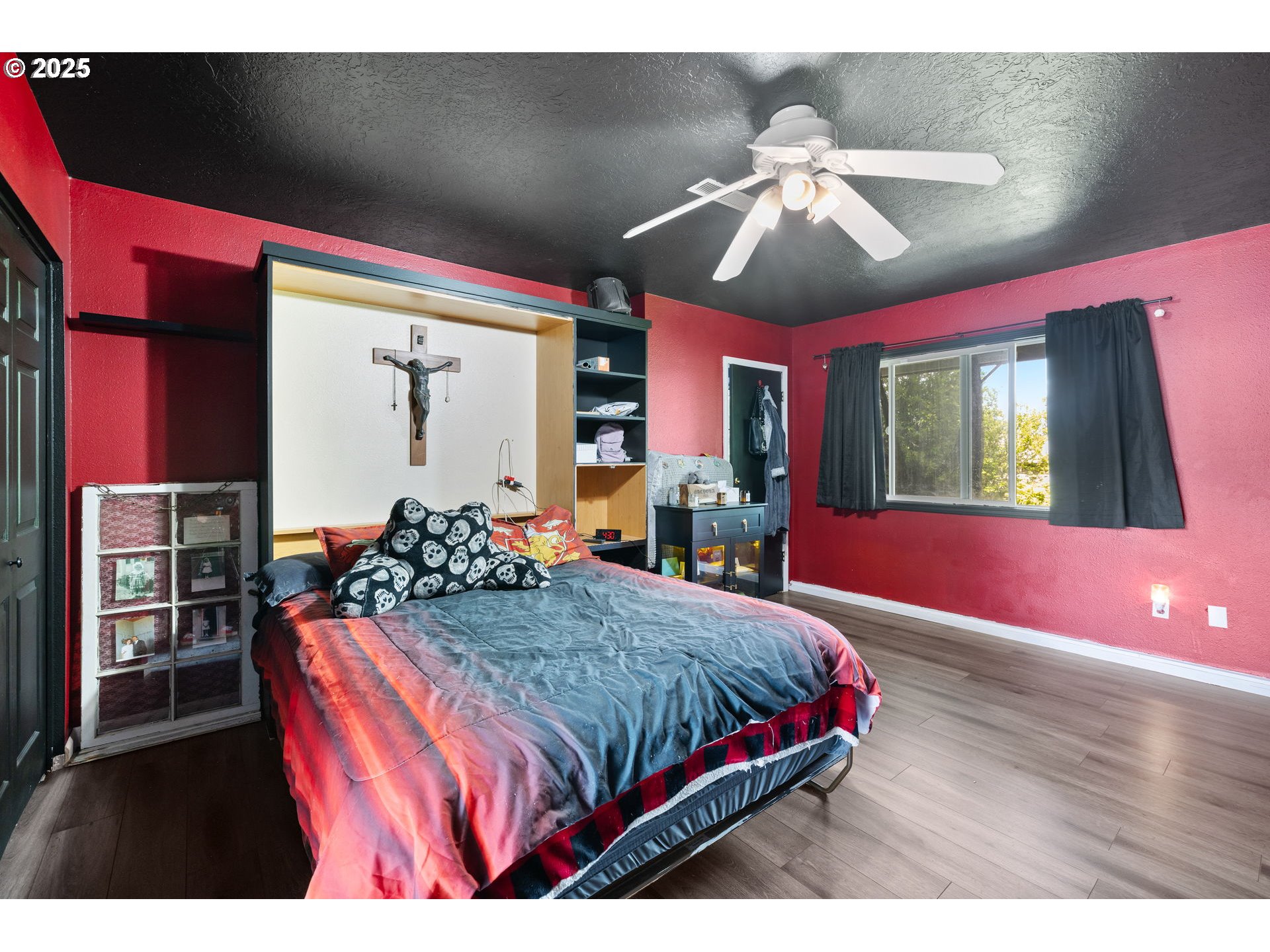 480 Northwest Norman Avenue Gresham, OR 97030 - Photo 20 of 40 a bedroom with a bed and wooden floor