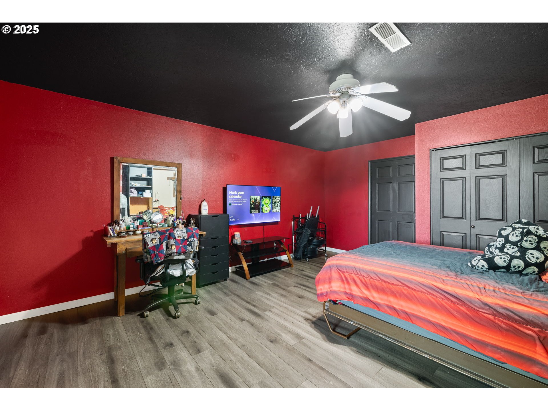 480 Northwest Norman Avenue Gresham, OR 97030 - Photo 22 of 40 a bedroom with bed and a chandelier