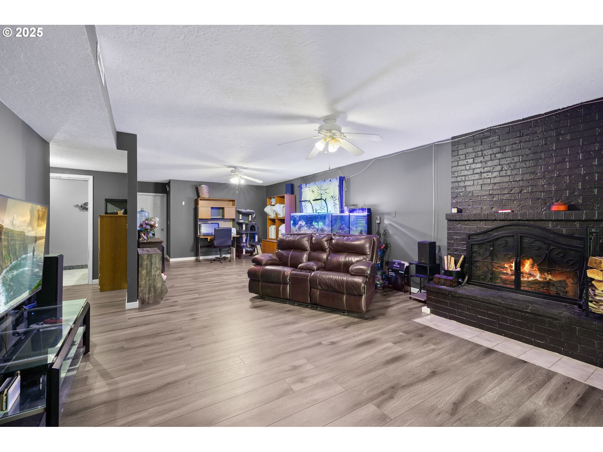 480 Northwest Norman Avenue Gresham, OR 97030 - Photo 23 of 40 a living room with furniture and a flat screen tv