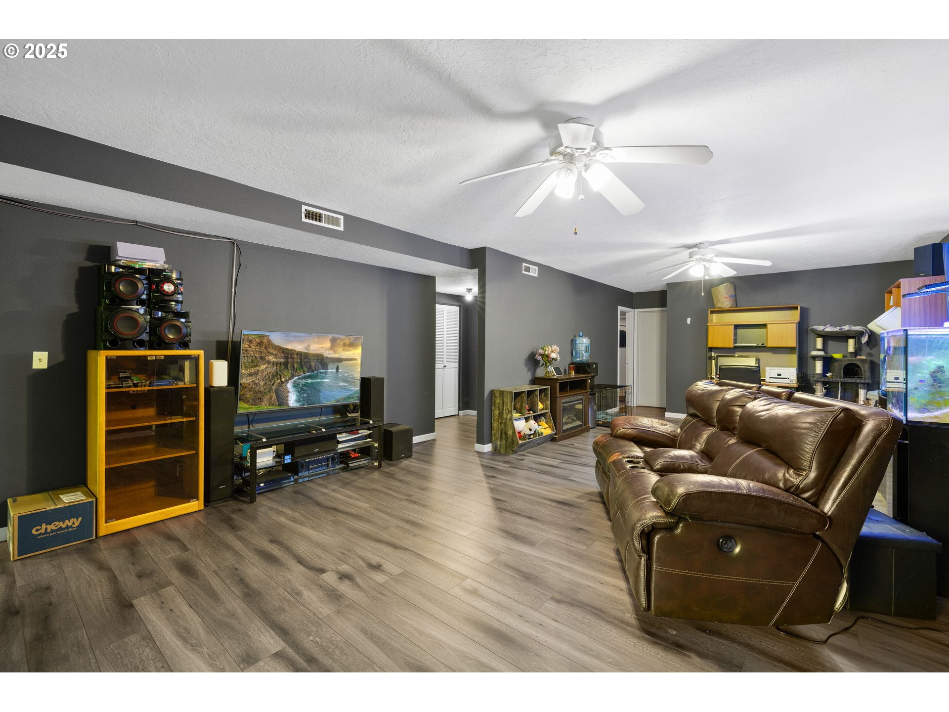 480 Northwest Norman Avenue Gresham, OR 97030 - Photo 24 of 40 a living room with furniture and a flat screen tv
