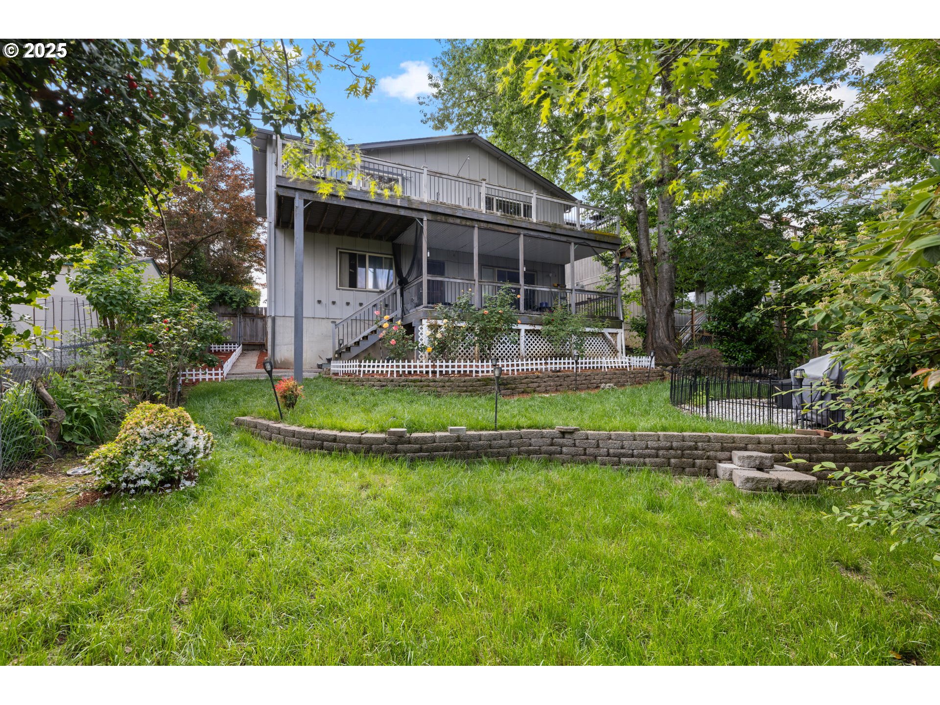 480 Northwest Norman Avenue Gresham, OR 97030 - Photo 33 of 40 a front view of a house with a yard table and chairs