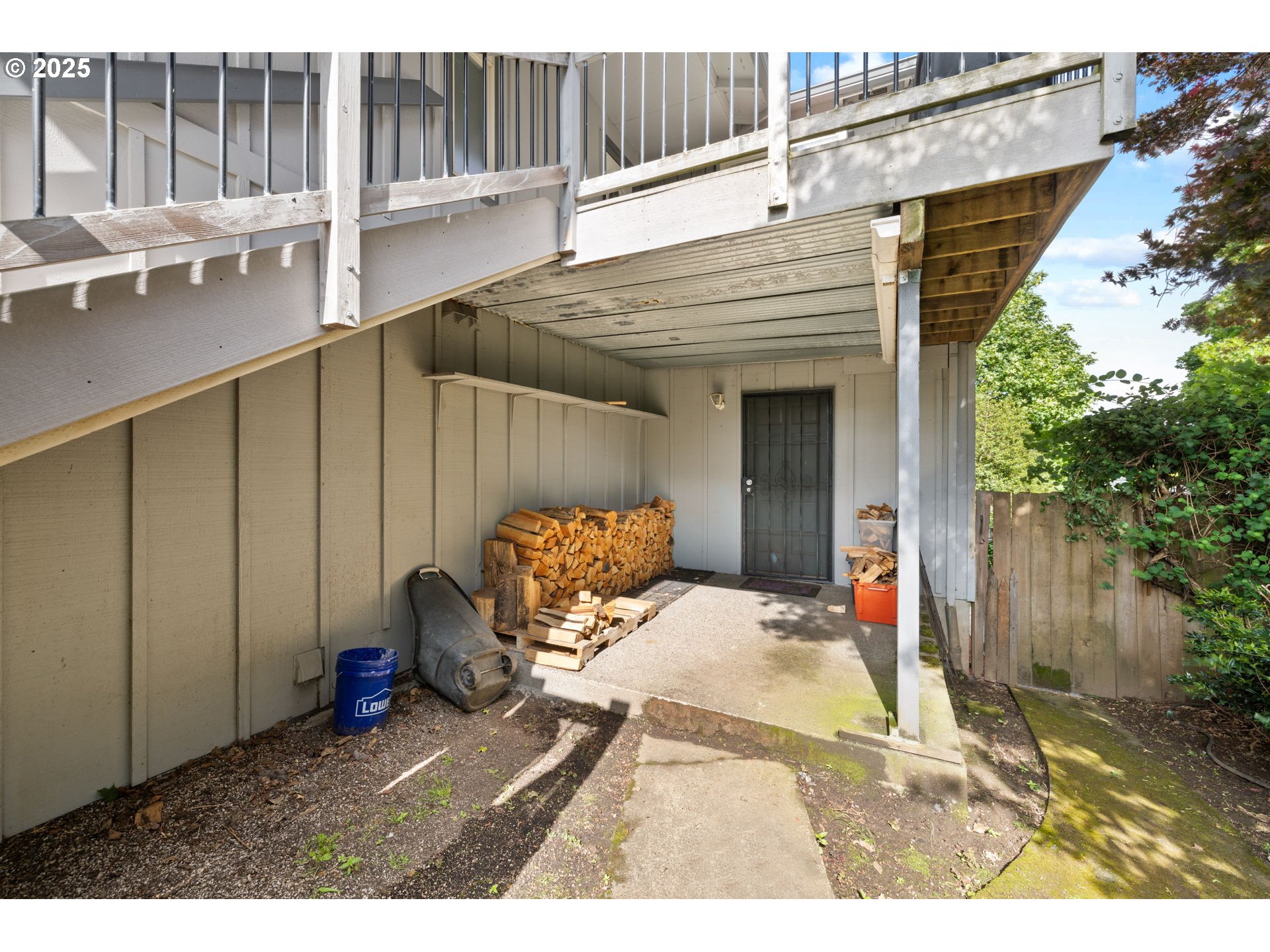 480 Northwest Norman Avenue Gresham, OR 97030 - Photo 38 of 40 a view of a backyard with a chair and table in the patio