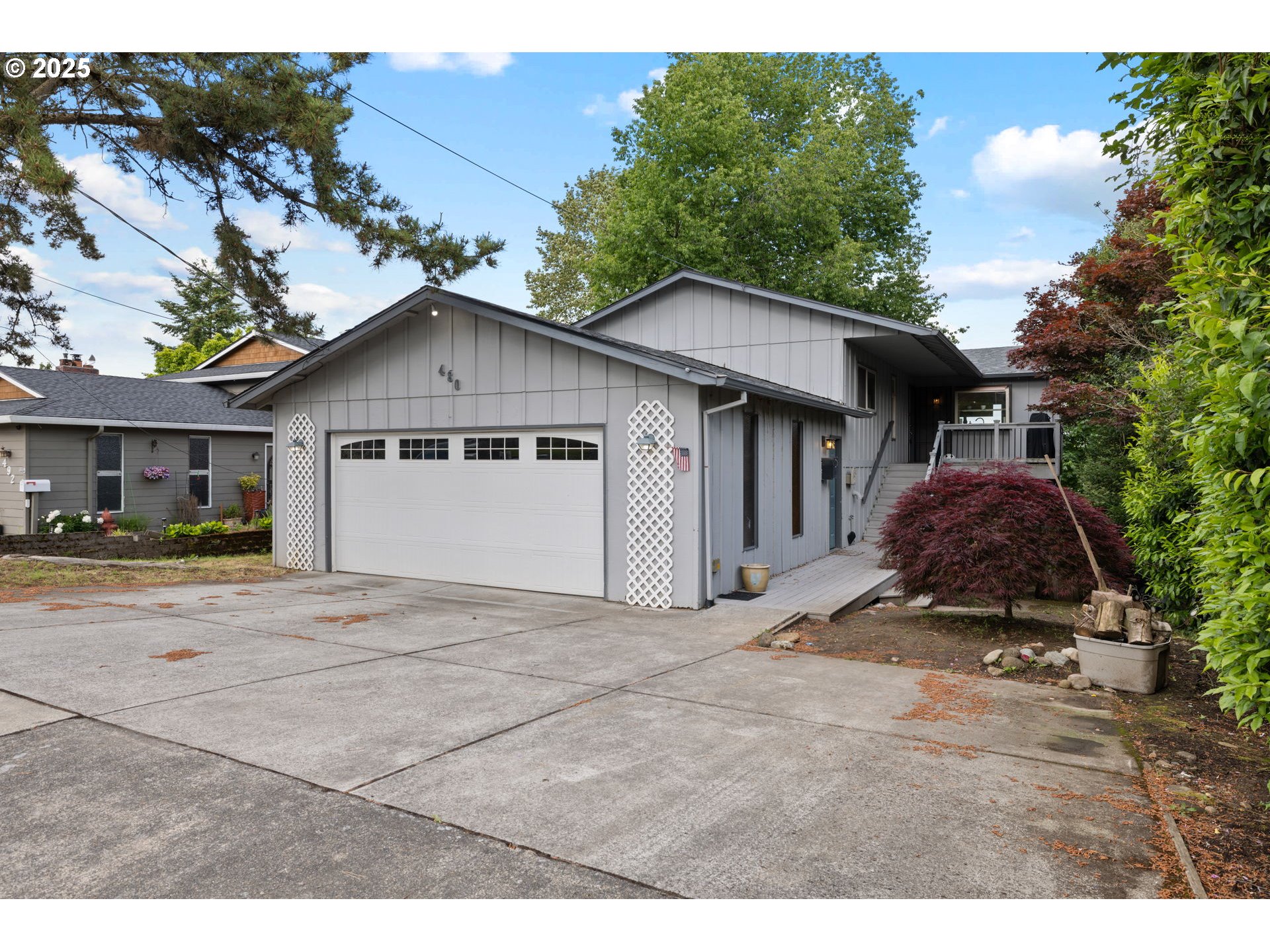 480 Northwest Norman Avenue Gresham, OR 97030 - Photo 39 of 40 a view of a house with a yard and large tree