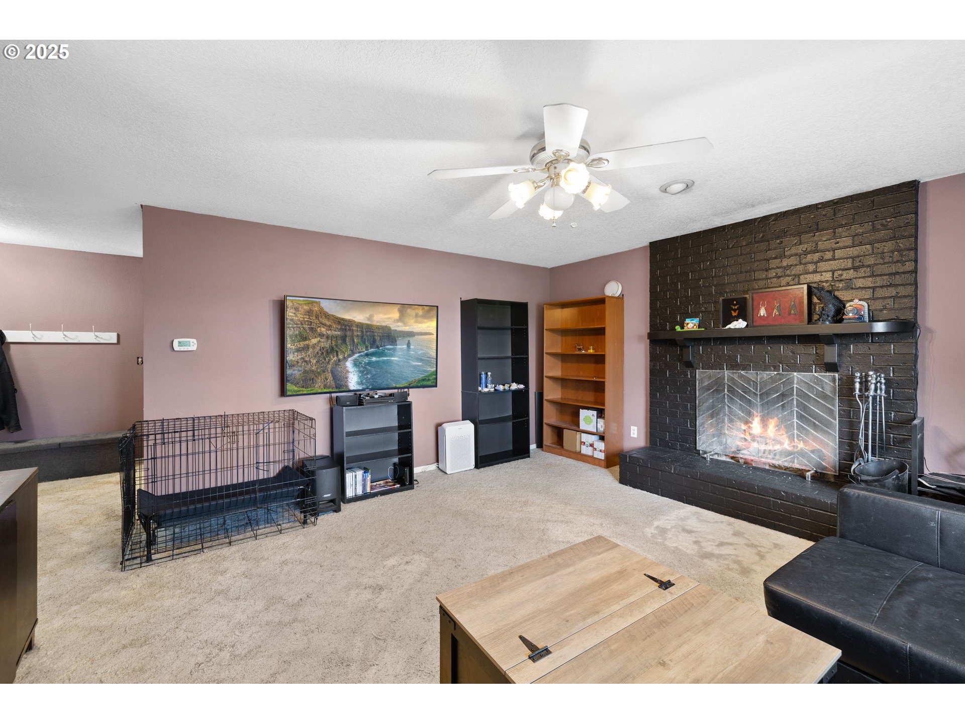 480 Northwest Norman Avenue Gresham, OR 97030 - Photo 5 of 40 a living room with furniture and a fireplace