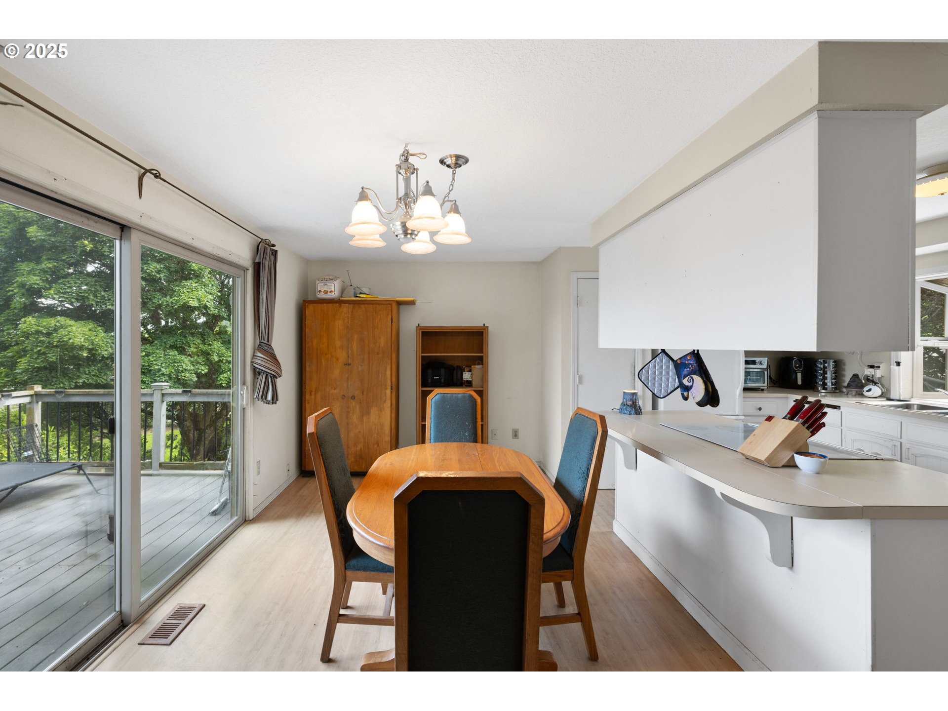 480 Northwest Norman Avenue Gresham, OR 97030 - Photo 8 of 40 a view of a dining room with furniture and wooden floor