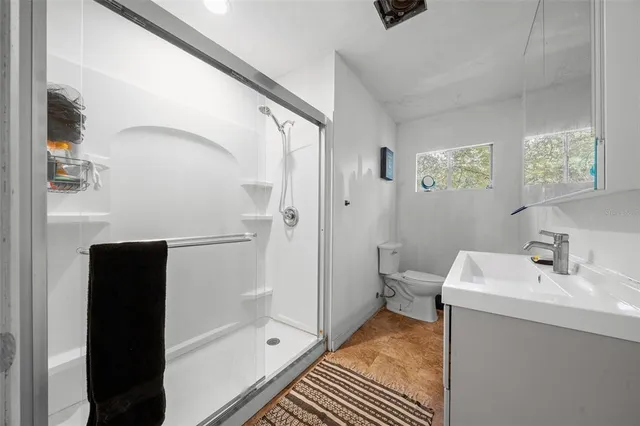 a bathroom with a sink and shower