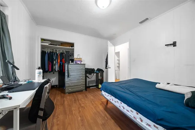 a view of a workspace with furniture and wooden floor