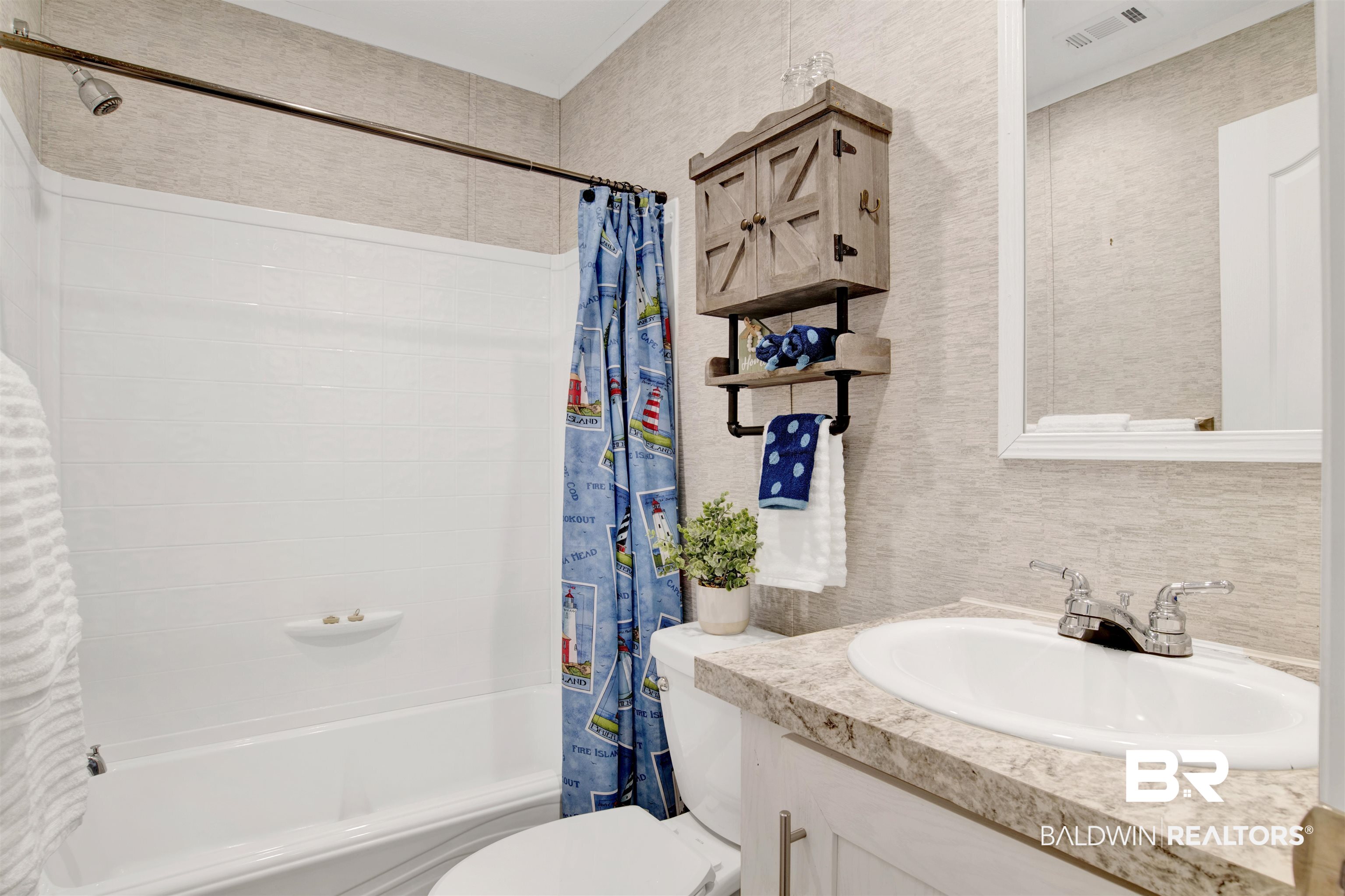 1411 Ridgewood Drive Lillian, AL 36549 - Photo 24 of 30 Full bathroom with shower / bath combo, tasteful backsplash, vanity, and toilet