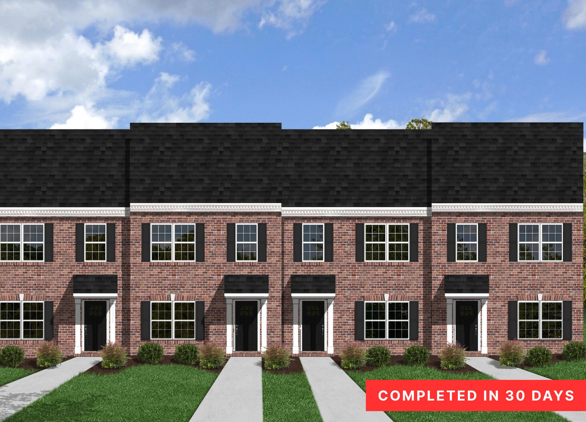 a front view of a building with a yard