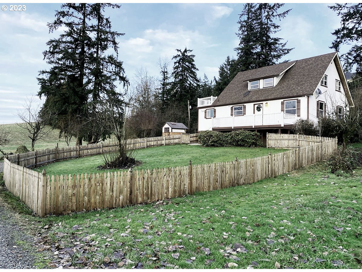 2514 Northwest 209th Street Ridgefield, WA 98642 - Photo 1 of 32 a front view of a house with a yard and tree