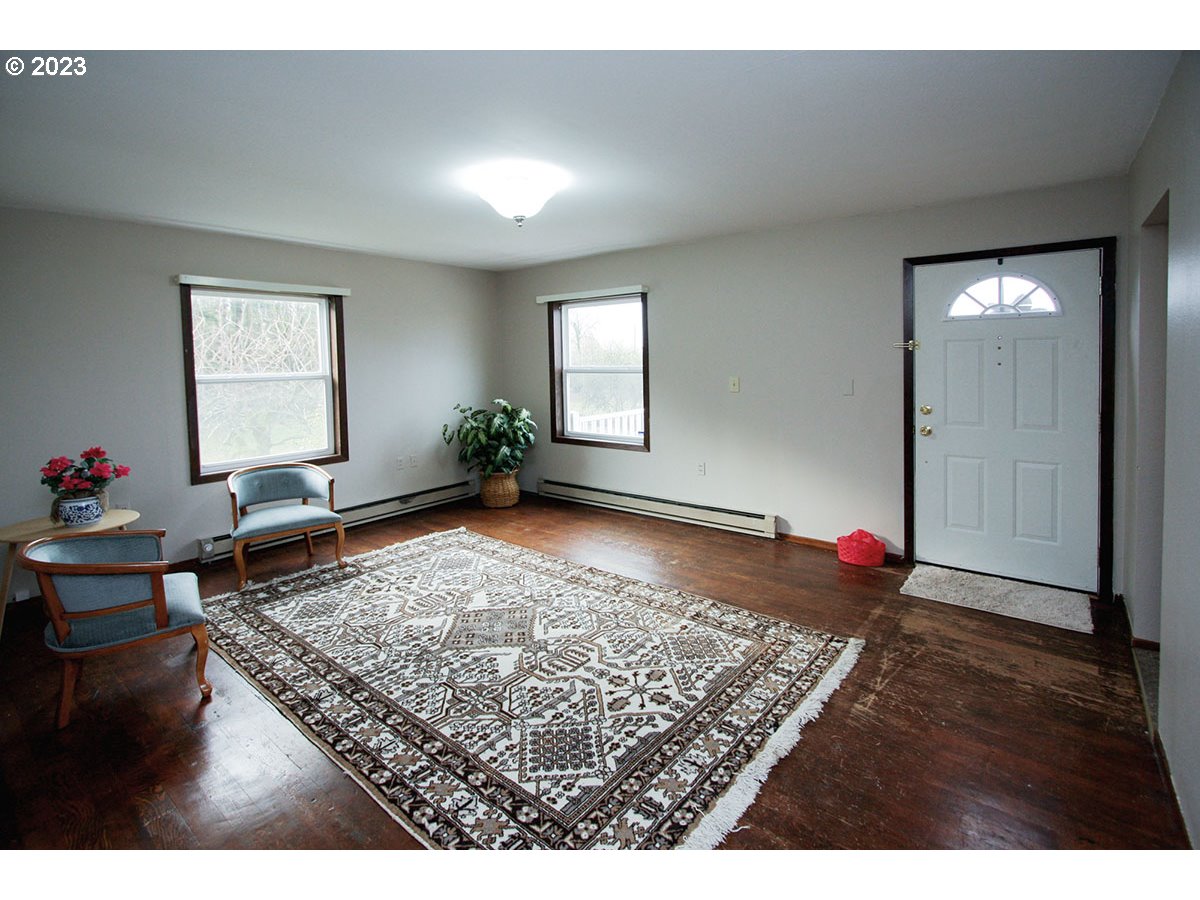2514 Northwest 209th Street Ridgefield, WA 98642 - Photo 8 of 32 a living room with furniture and wooden floor