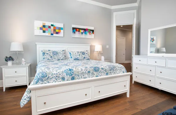 a bedroom with a bed and a dresser